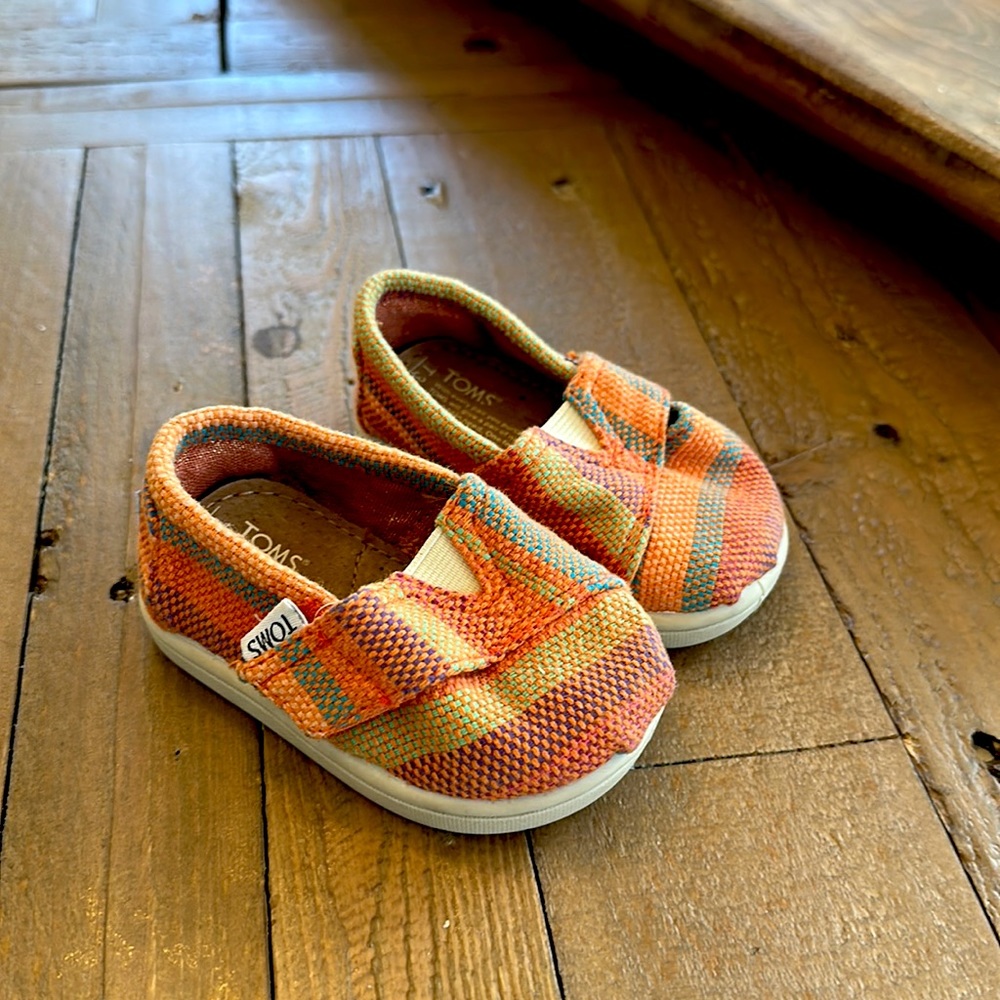 Adorable toddler Toms shoes.